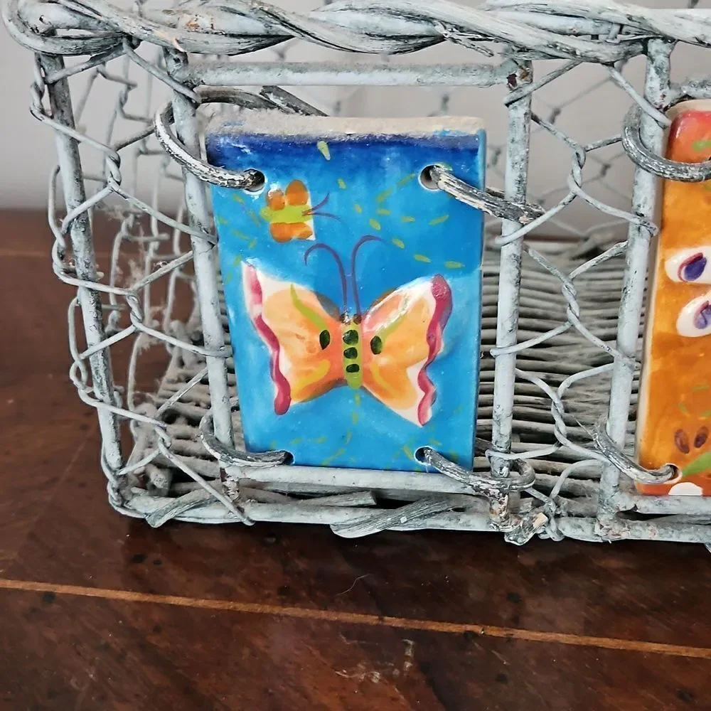 Vintage basket decorated with ceramic tiles